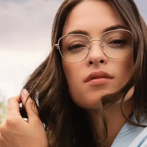 A female model wears Charriol glasses.