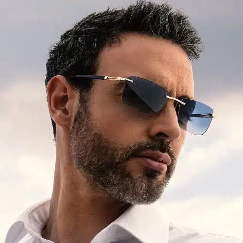 A male model wears Charriol sunglasses.