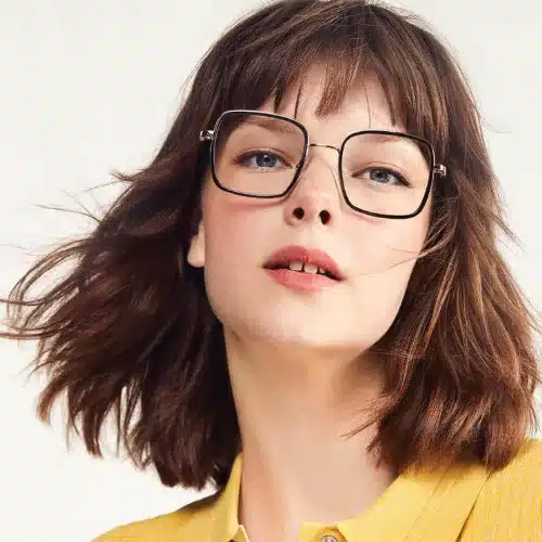 A female model wears Lancel glasses.