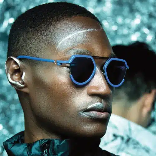 A male model wears Maison Jean-François Rey sunglasses.